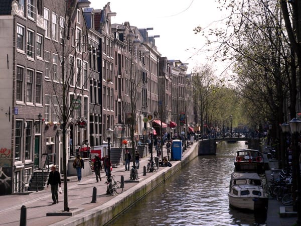 tall houses along a canal in Amsterdam