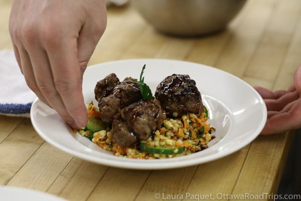 putting the finishing touches on lamb meatballs during a cooking class at the waring house inn.