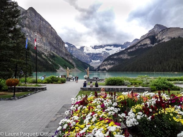 lake louise gets its blue-green colour from tiny pieces of rock swept into the lake by glaciers. the little particles reflect green and blue wavelengths of light from the sun. taken on the grounds of the fairmont chateau lake louise.