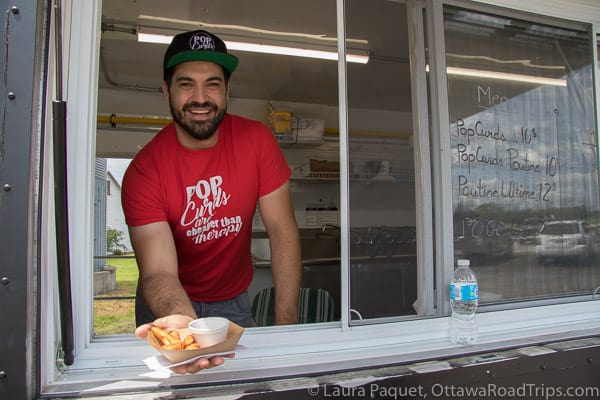 marc gagne, owner of popcurds in casselman, serves up breaded, fried st. albert cheese curds at the popsilos launch.