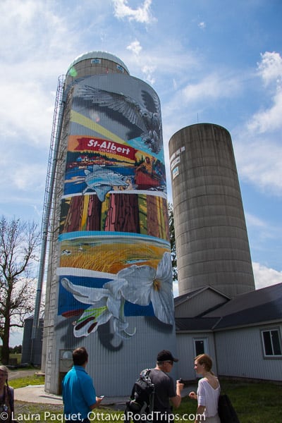 the art on the ben-rey-mo ltd. farm in st. albert evokes vintage postcards celebrating fishing and other local activities.