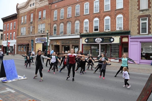 People dancing on a Brockville street.