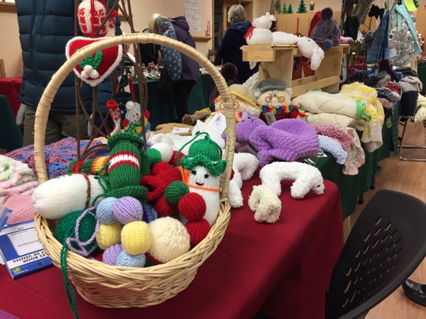 knitted toys and blankets on tables at an ottawa christmas market