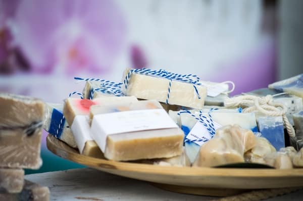 A plate with beige handmade soaps tied with string.