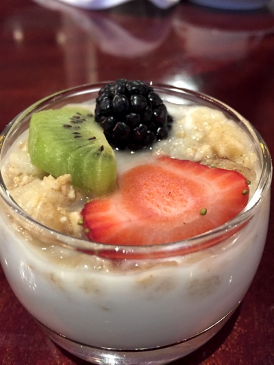 glass of yogurt with strawberry, kiwi, blackberry and muesli.
