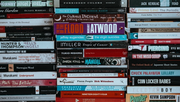 Used books stacked with spines out. Photo by Annie Spratt on Unsplash.