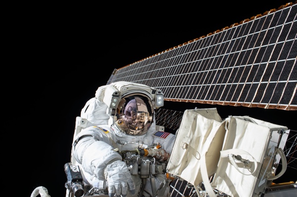 astronaut doing spacewalk. photo by nasa on unsplash.