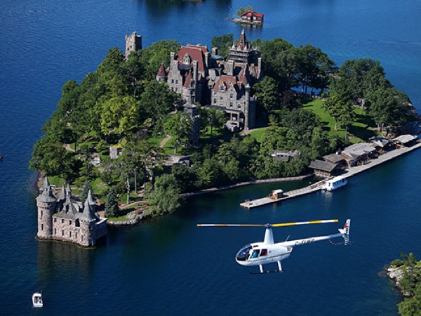 helicopter above boldt castle. photo courtesy of 1000 islands helicopter tours.