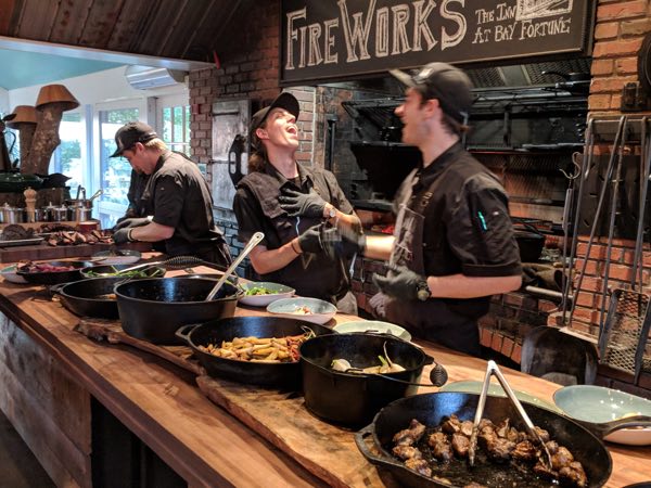 The cooks serve up the amazing FireWorks Feast at the Inn at Bay Fortune. Photo by Katharine Fletcher.