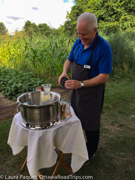 jay nutt, the food and beverage service manager at elmhirst's Resort in Keene, Ontario, mixes up rhubarb cocktails with gin from the new Black's Distillery in nearby Peterborough.