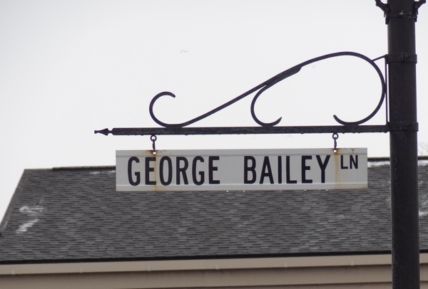 street sign reading george bailey lane in seneca falls, new york.