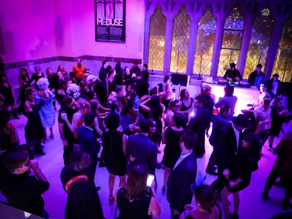 People dancing to a DJ in the "lantern" at the Canadian Museum of Nature during Nature Nocturne.