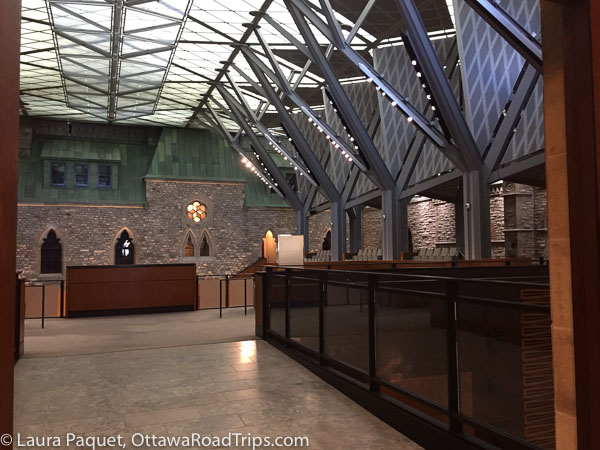 metal buttresses support the glass roof above the corridor outside the new house of commons chamber in west block on parliament hill in ottawa.
