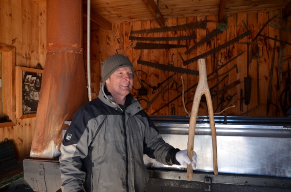 Ti-Mousse showing one of the many artifacts in the museum surrounding his maple syrup boiler. Photo: Eric Fletcher.