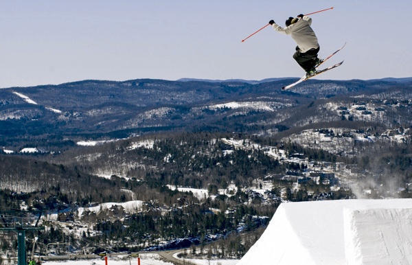 Freestyle skier jumping off a ramp at Tremblant in Quebec.