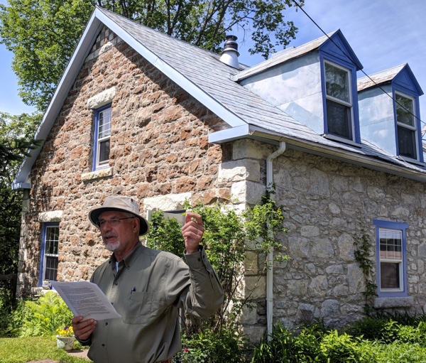 Portage-du-Fort historical tour leader, Chris Seifried, explains the history of stone dwellings in the village on June 1 and 2. Photo by Katharine Fletcher.