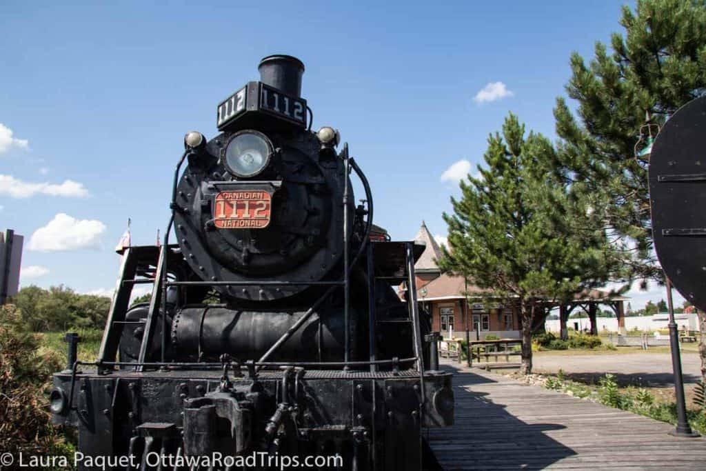 antique steam train on track at railway museum of eastern ontario
