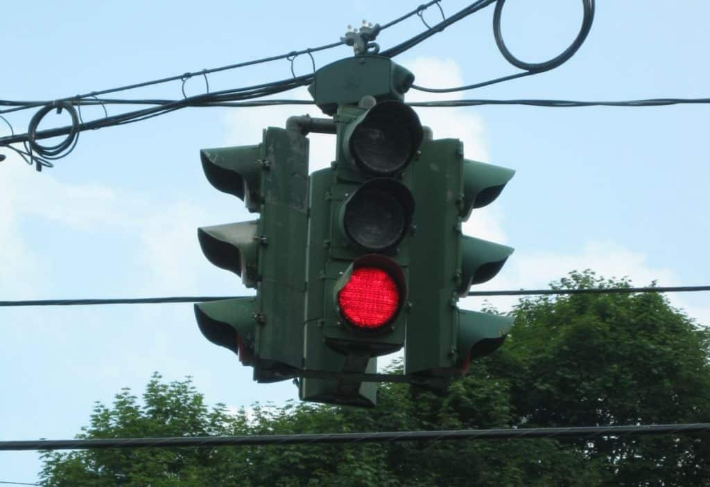 traffic light with red on the bottom in tipperary hill, syracuse, new york.