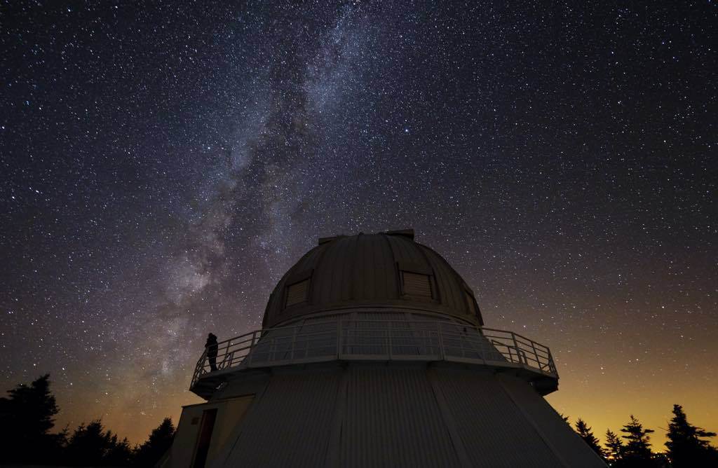 telescope observatory dome against a starry sky in mont megantic national park.