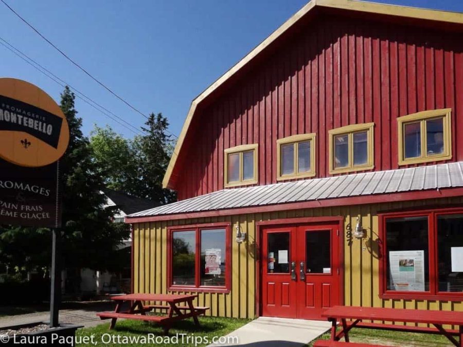 red and yellow building with a gambrel roof