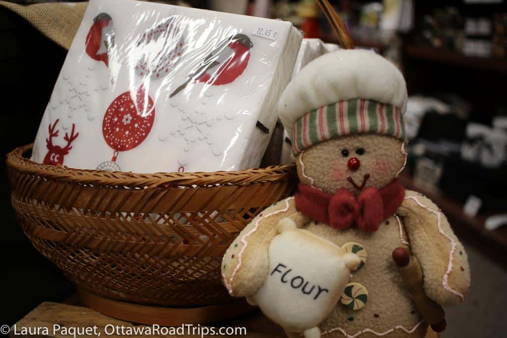 red-and-white christmas serviettes and gingerbread man toy in a shop in almonte.