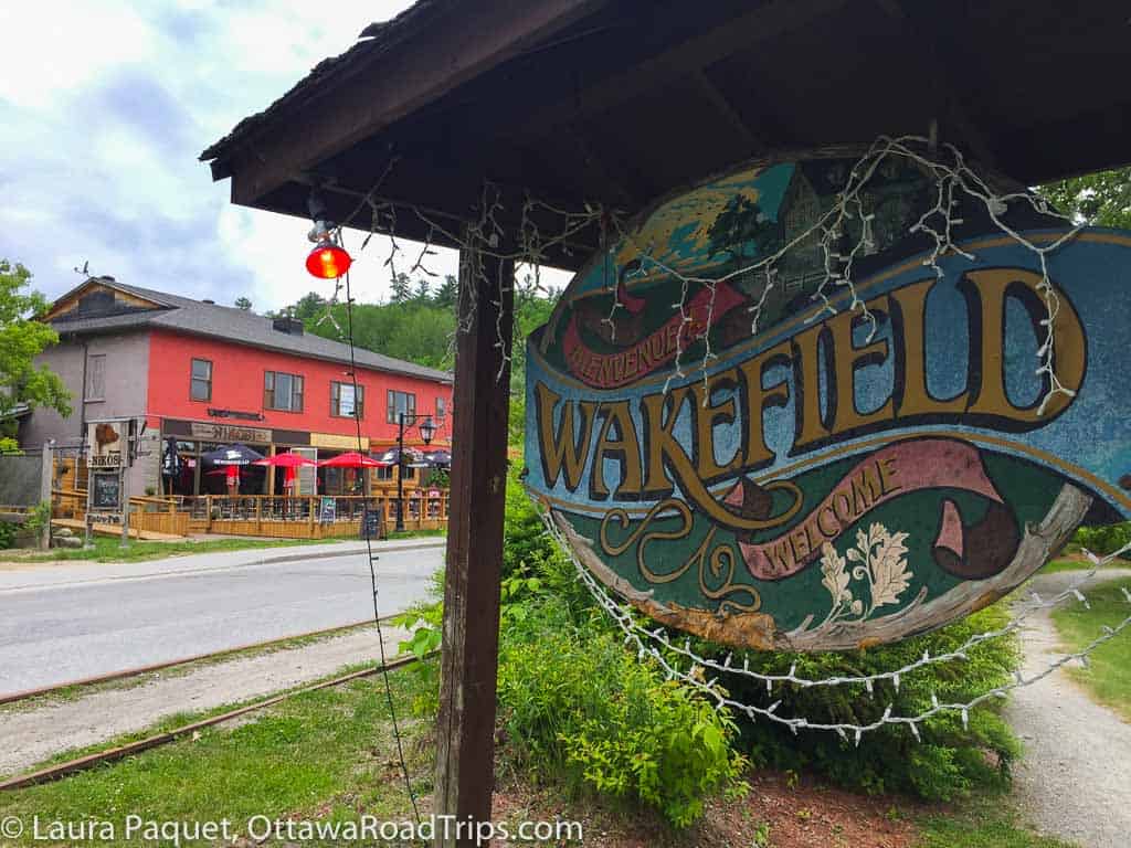 wakefield sign with small shops in background