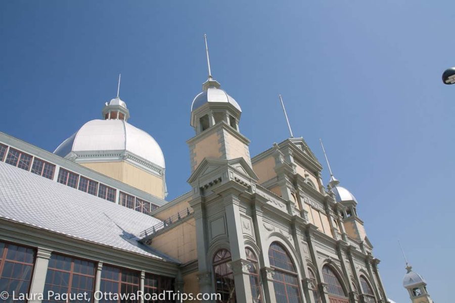 large domed yellow building with metal roofs and fancy trim
