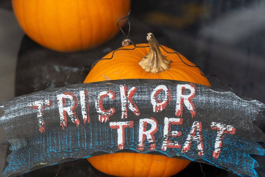 pumpkins and a banner reading trick or treat