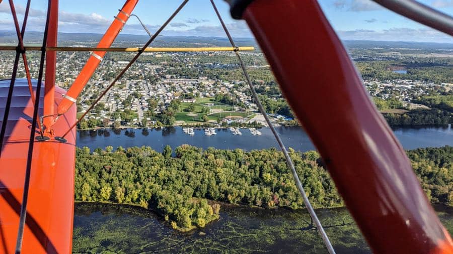 aerial view of kitchissipi marina in gatineau and kettle island in the ottawa river, with red plane struts in foreground.