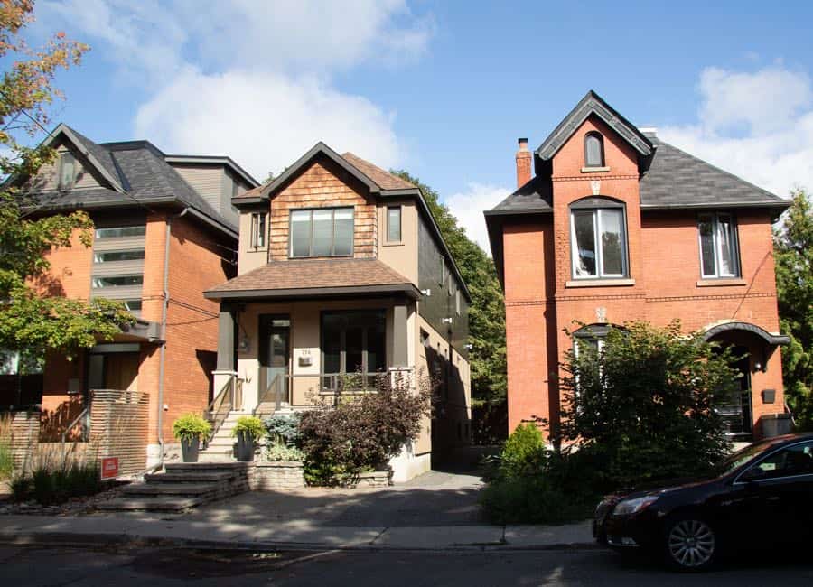 three large houses (one old, one new, one mixed) on a quiet street in the glebe