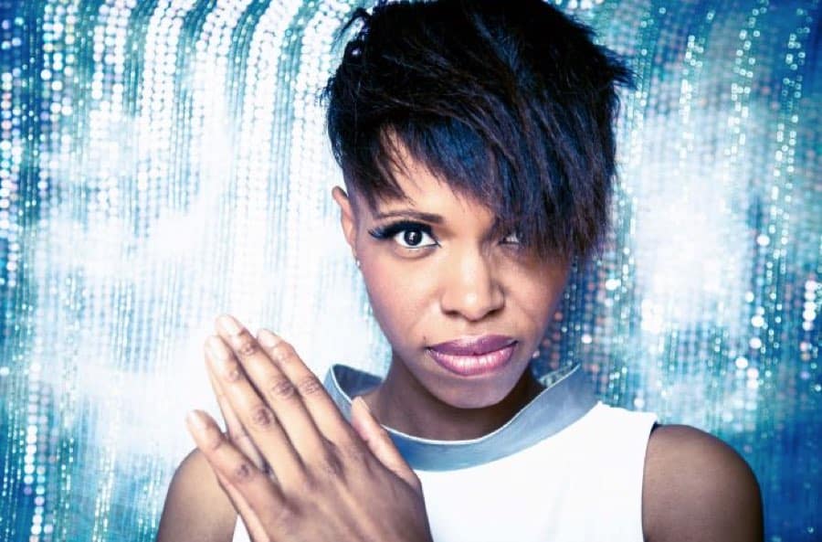 closeup of kellylee evans against a silver background