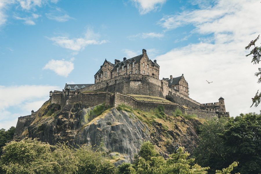 Large stone castle high on a hill.