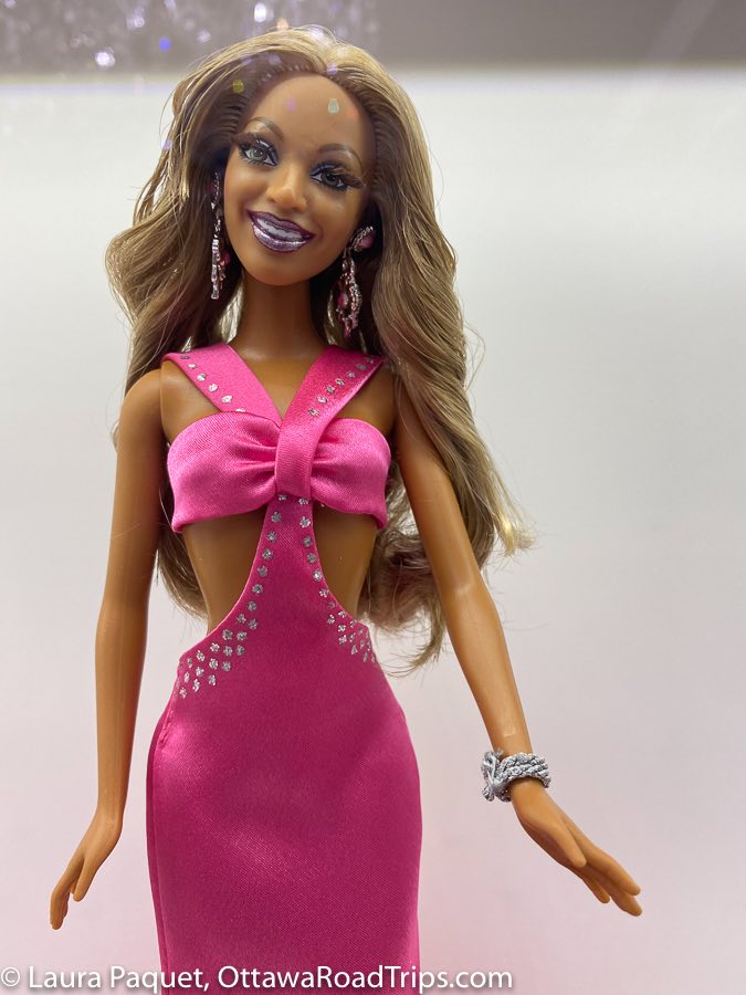 beyoncé barbie in bright pink halter dress with sequins