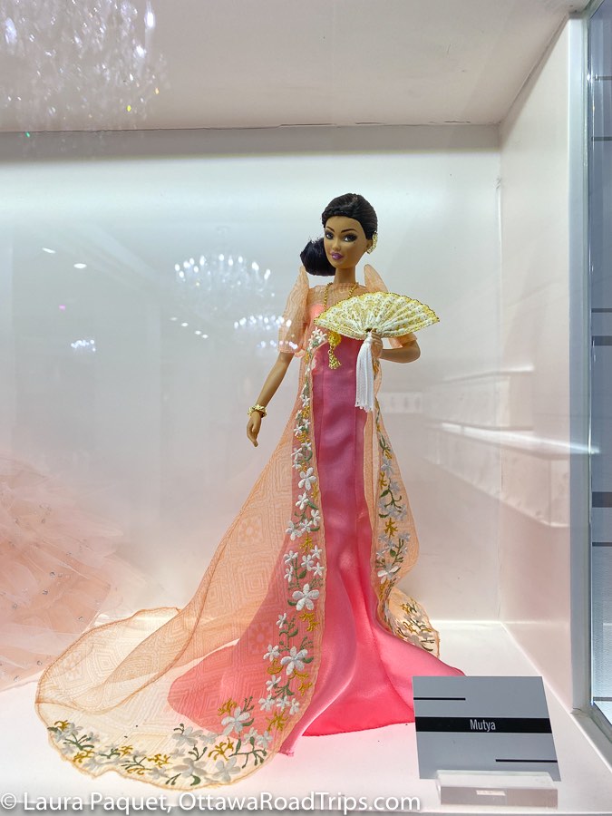 mutya barbie in long pink dress with peach-coloured embroidered overdress and gold fan
