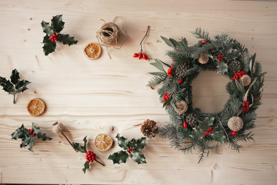 wreath and craft supplies on a wooden table