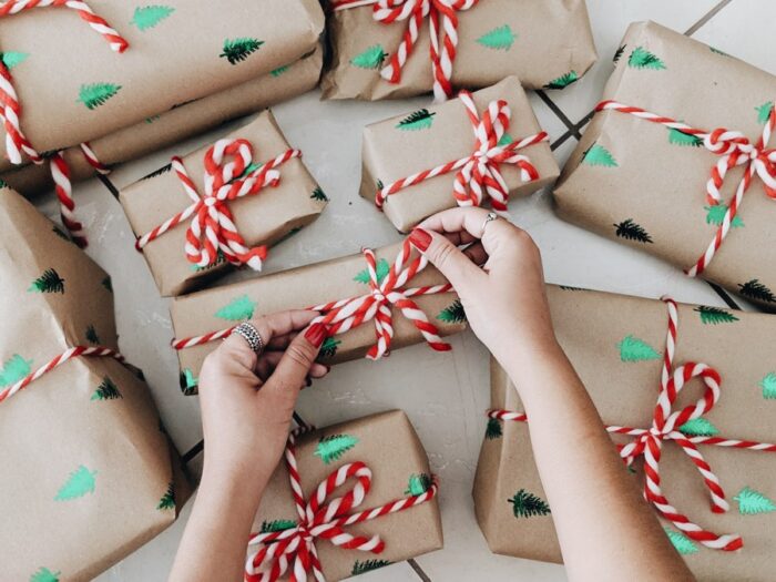 presents wrapped in brown paper with red and white ribbons and candy canes