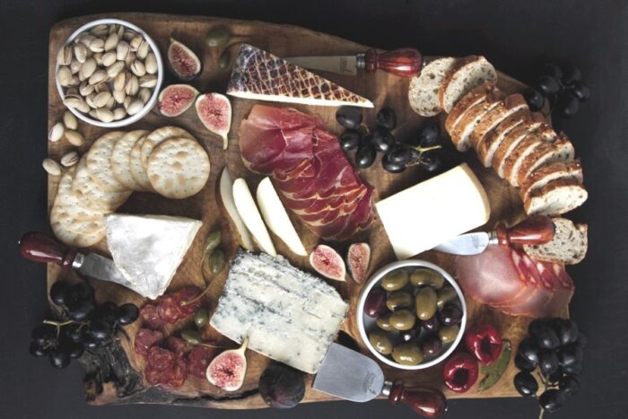 large charcuterie board of meats and cheeses