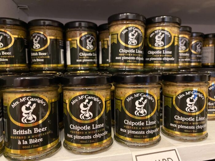 closeup of small jars of mustard