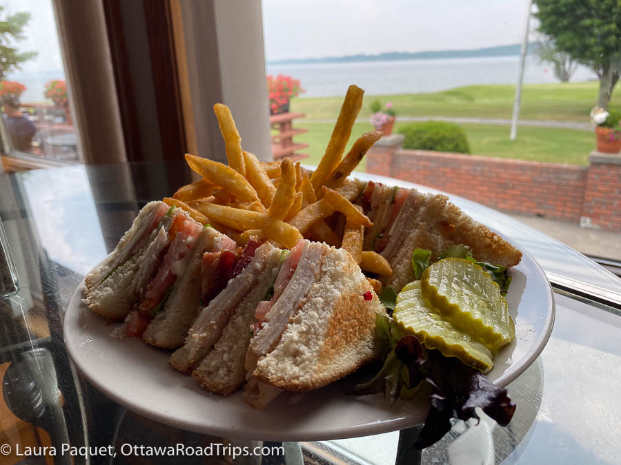 a turkey club sandwich and fries on a white plate at chase's Riverside Dining, on the northern edge of St. Lawrence County, New York.