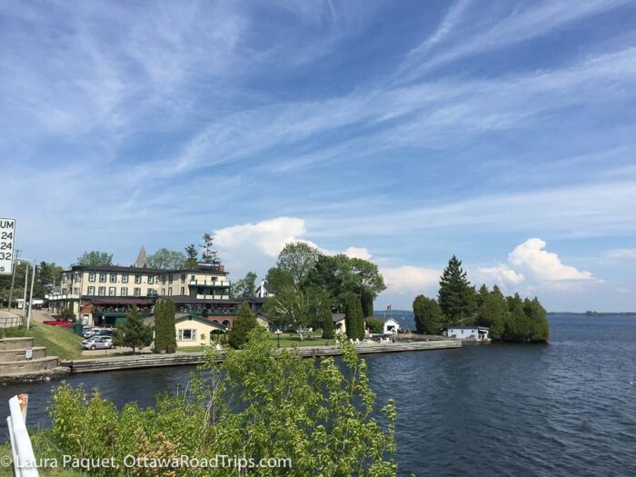 white buildings and green trees on the gananoque waterfront