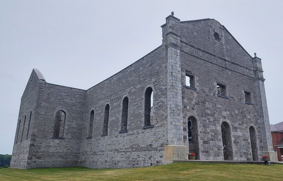 limestone walls of a very large roofless church. st. raphael's Ruins in Williamstown (South Glengarry), Ontario.