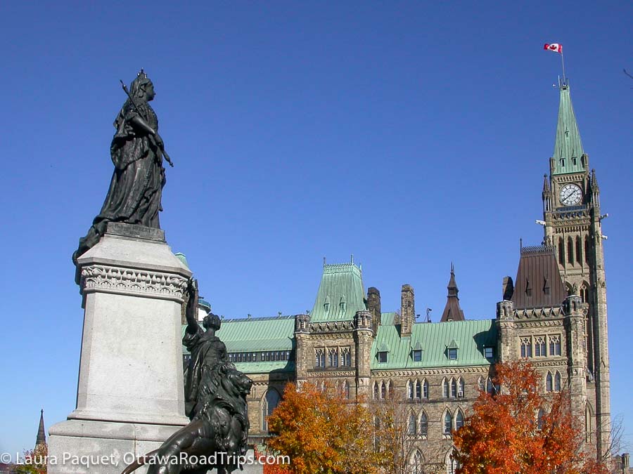 statue of queen victoria facing the peace tower and centre block on parliament hill in 
