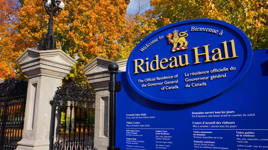 ontario fall colours in full display near the stone entrance gates of rideau hall in ottawa.