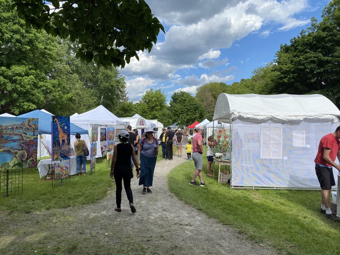 art in the park glbeebeeb - Ottawa Road Trips peple walking past white tents of art displays on a path through a green park