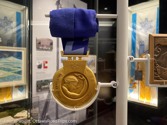closeup of a women's bobsleigh gold medal from Salt Lake 2002 Winter Olympic Games