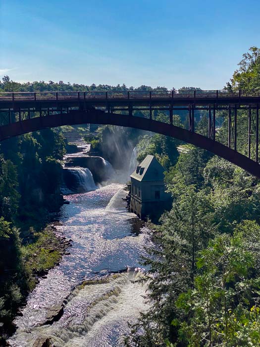 ausable chasm waterfall with bridge above it