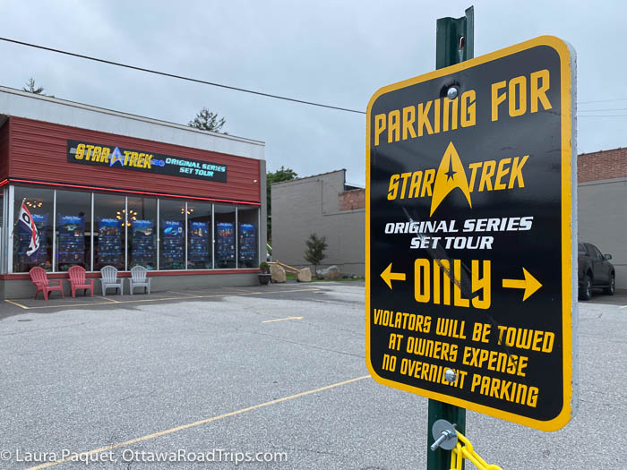 black and yellow sign in star trek original series set tour parking lot in ticonderoga, new york