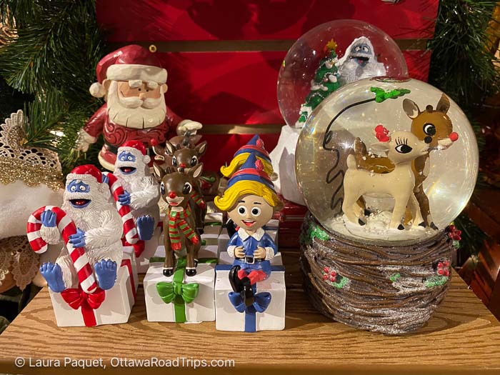 display of figurines from rudolph the red-nosed reindeer, including santa, the abominable snowman and hermey the elf