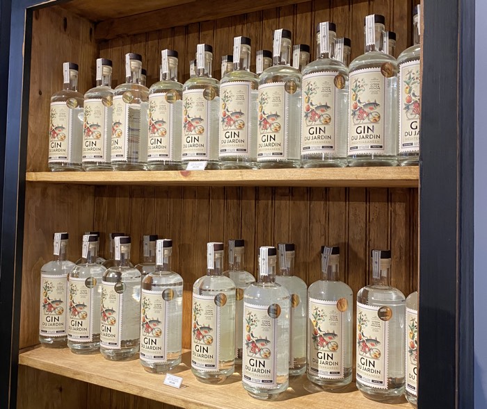 bottles of gin in a wooden cabinet