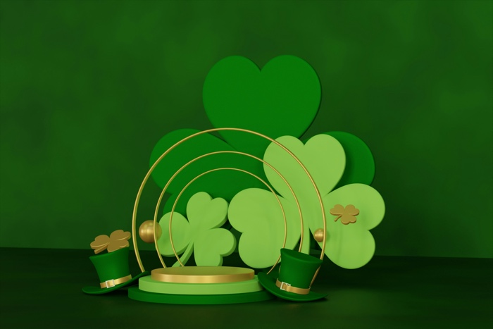 shamrock cutouts and a green hat against a green background